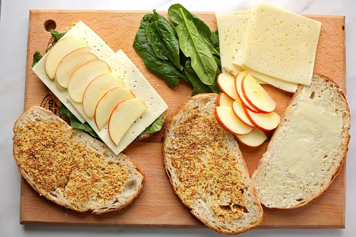 cutting board with ingredients to make grilled cheese sandwich