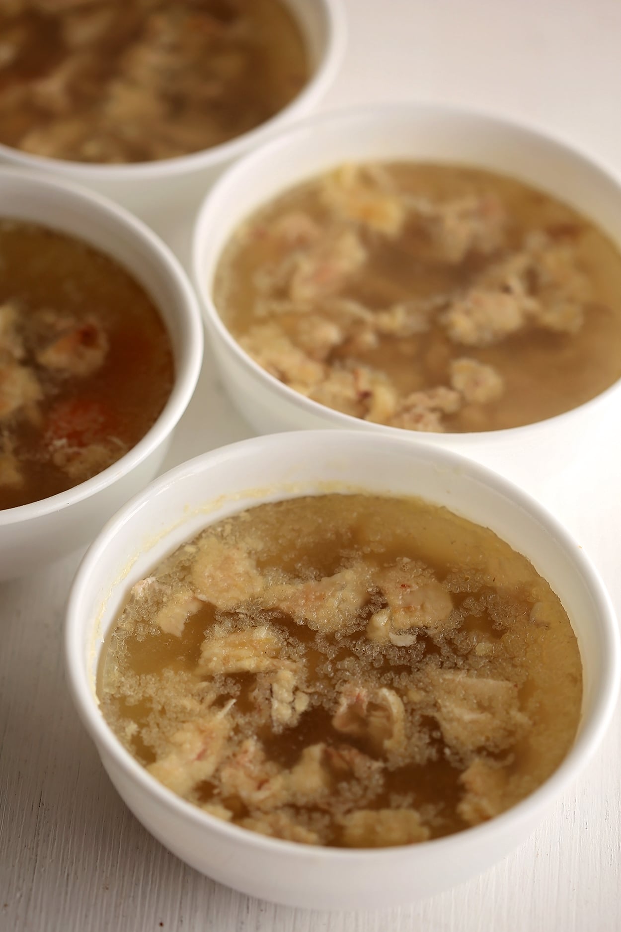 white bowls filled with meat jello