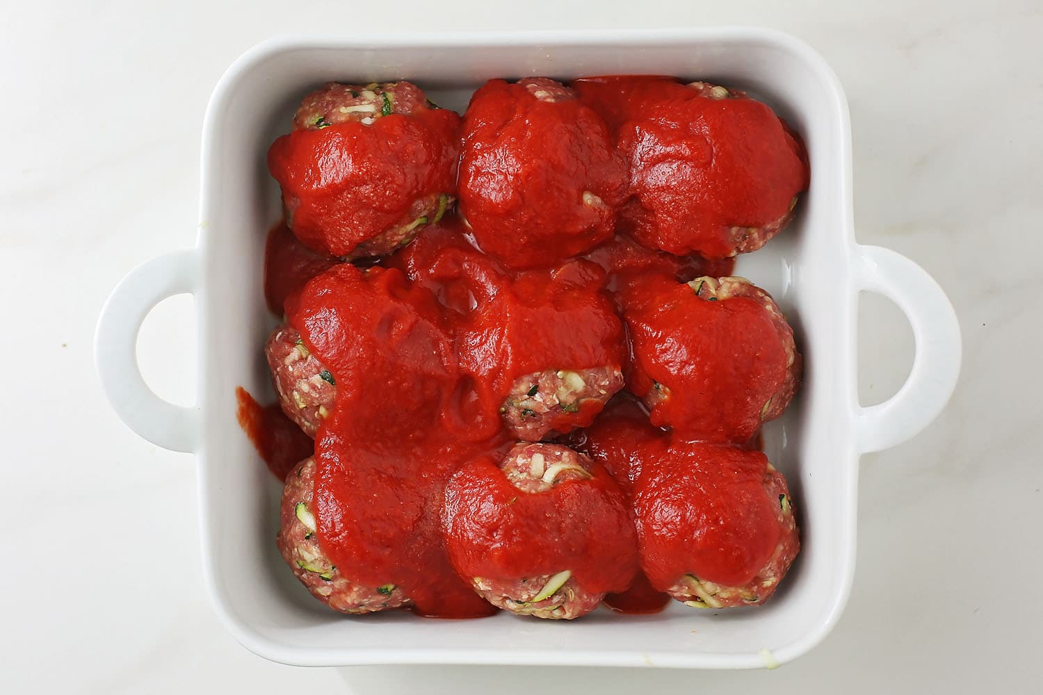 meatballs with tomato sauce in the baking dish