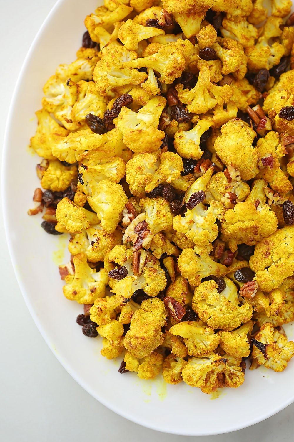 oval plate with curry roasted cauliflower with raisins