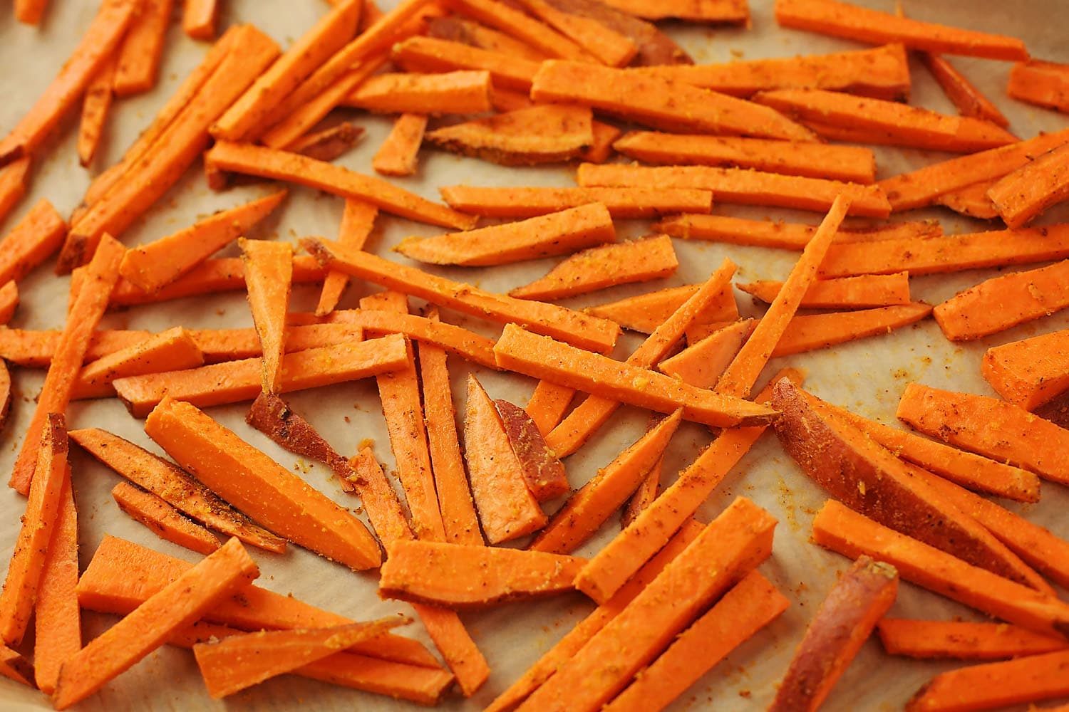 sheet pan with sweet potato sliced to make french fries
