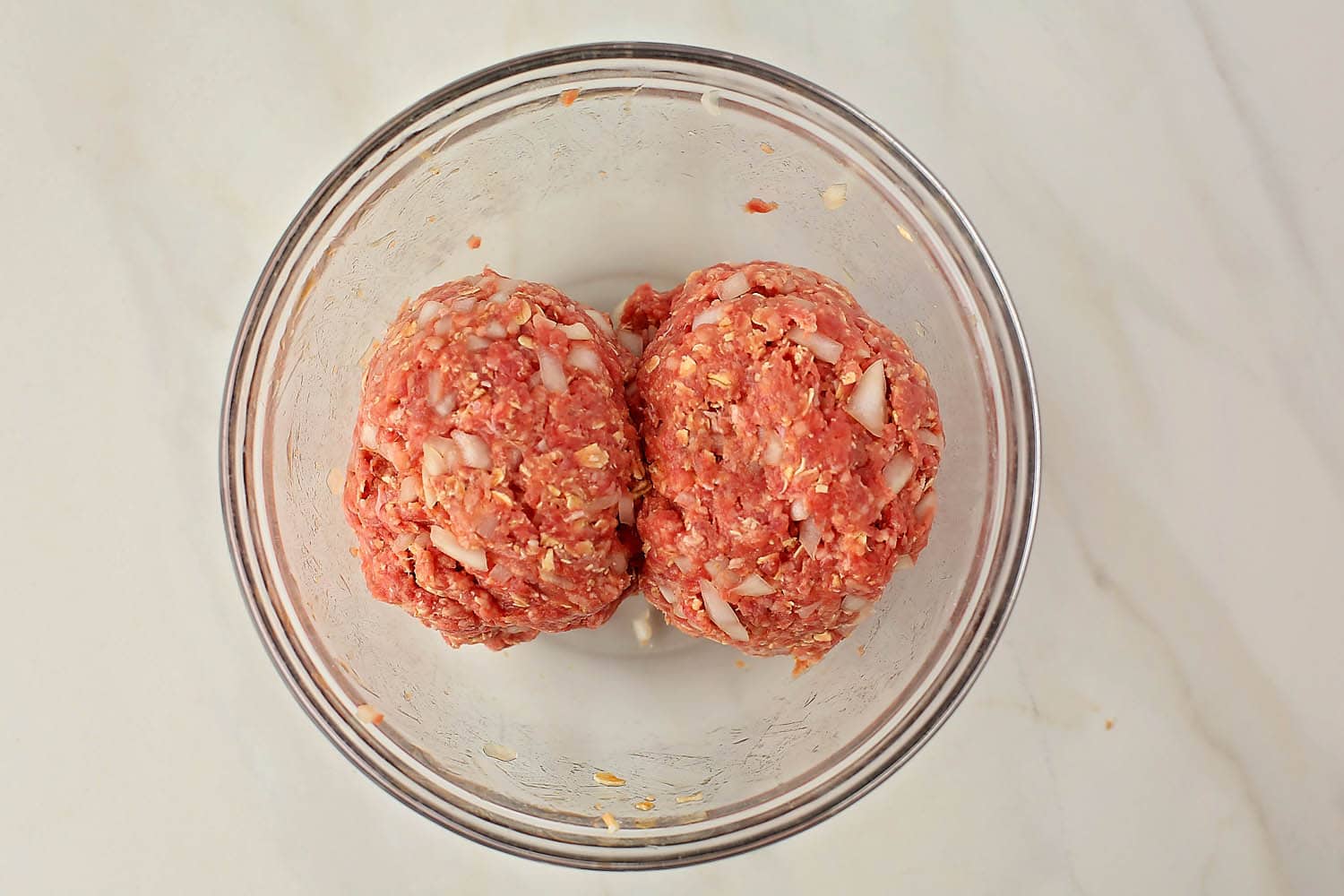 mixing bowl with two balls of ground beef
