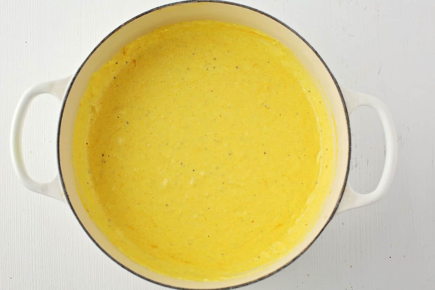 pot with yellow sauce for pasta