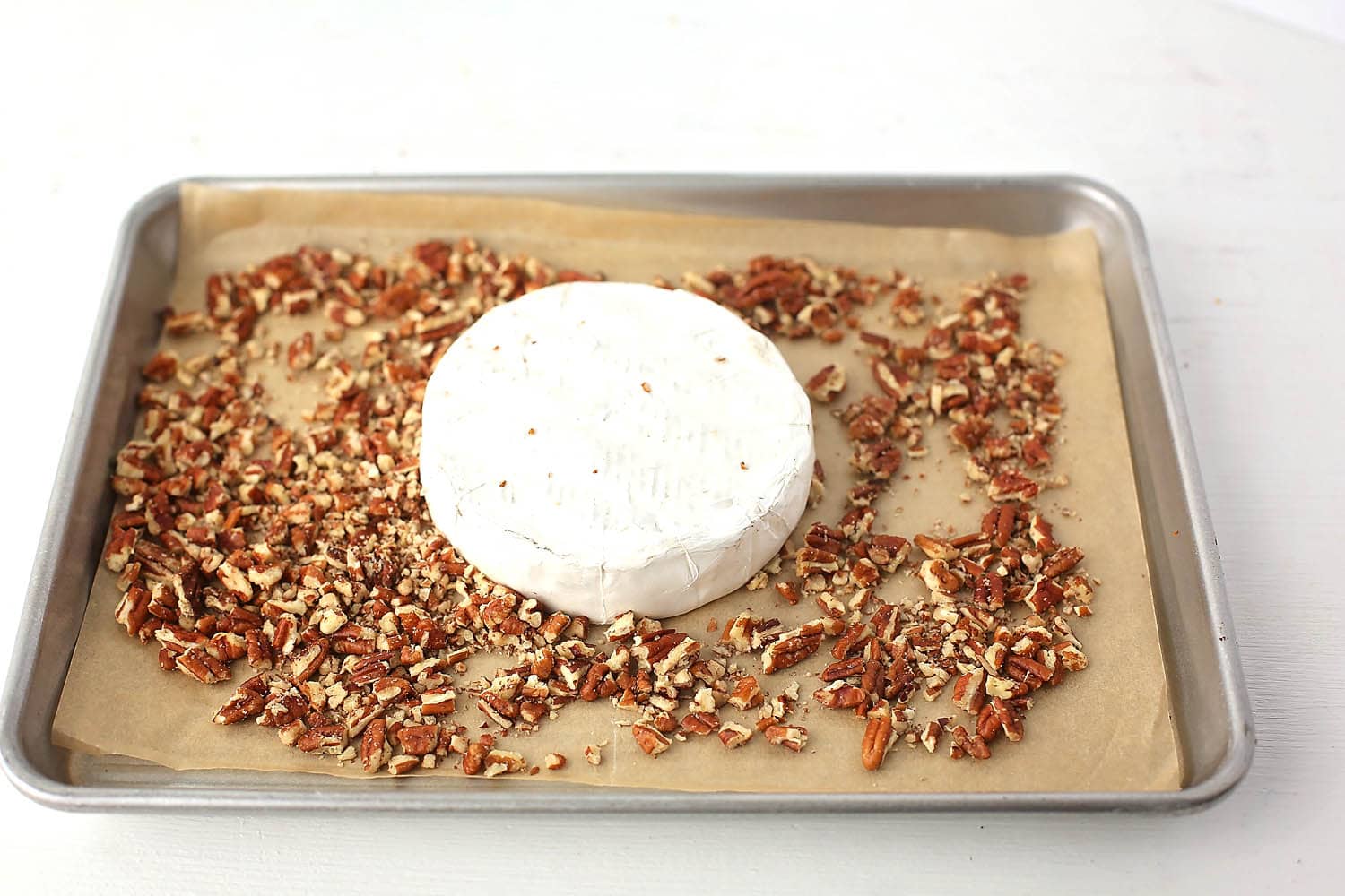 sheet pan with brie cheese and pecans