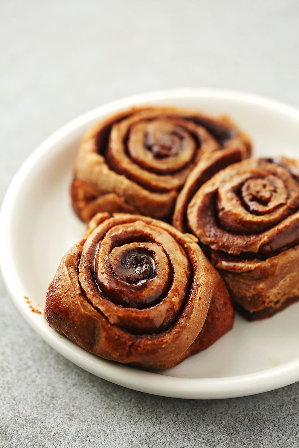 plate with three cinnamon rolls