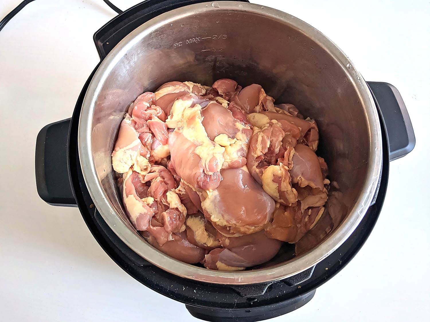 instant pot with raw chicken thighs