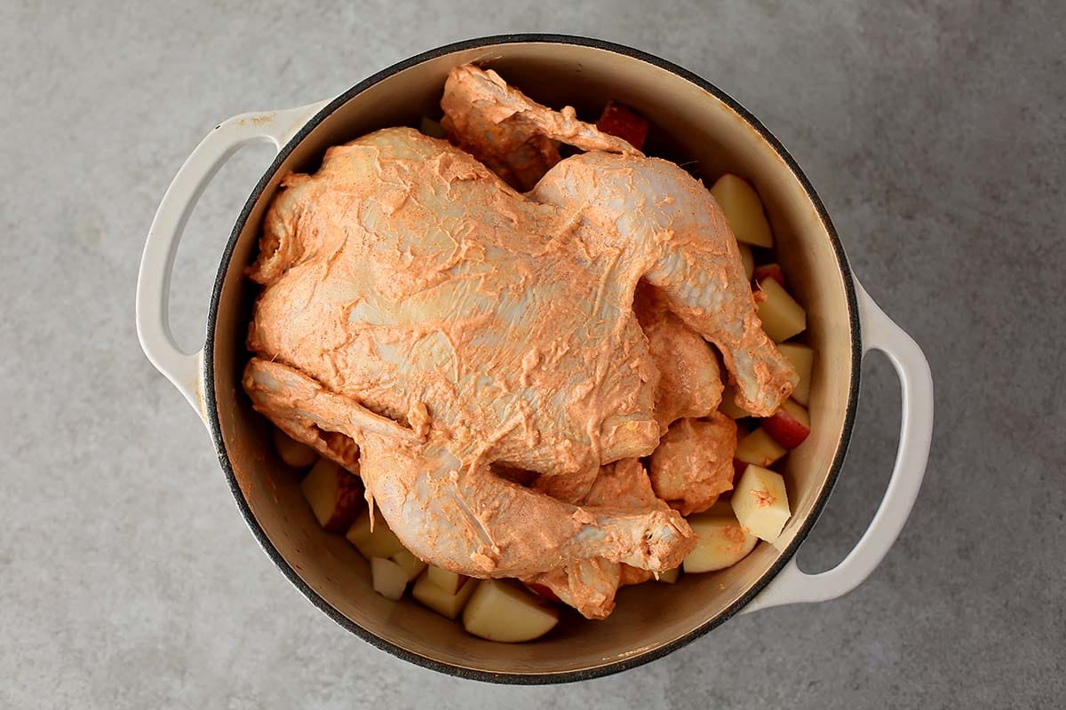 dutch oven with raw chicken inside