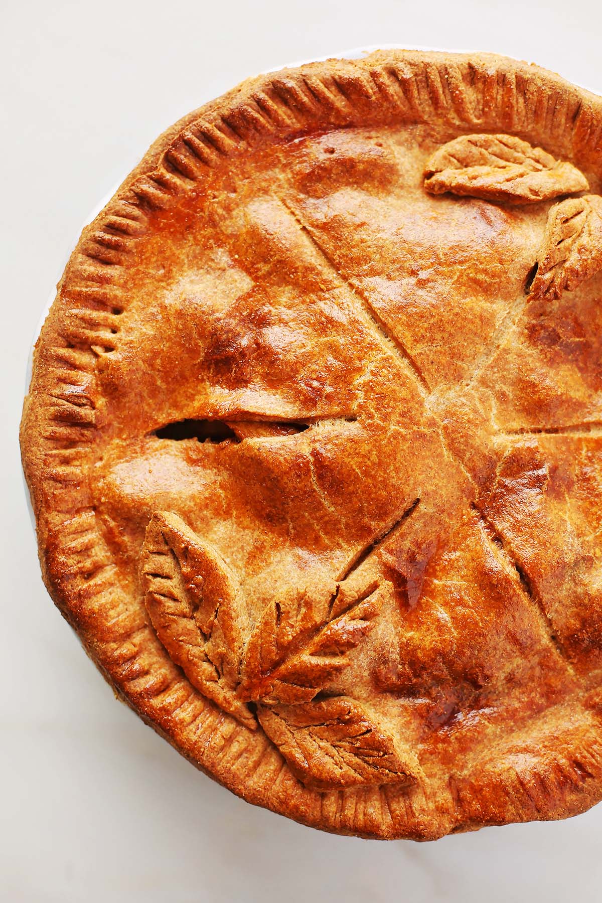 top of the baked apple pie with some decorative elements