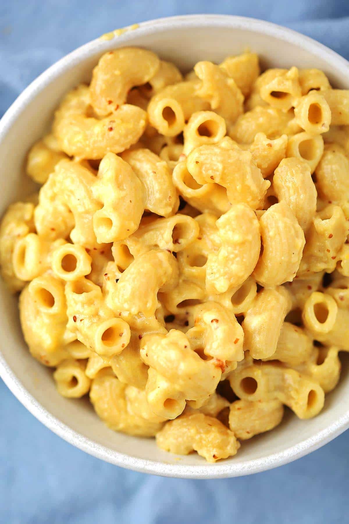 white bowl with creamy yellow mac and cheese