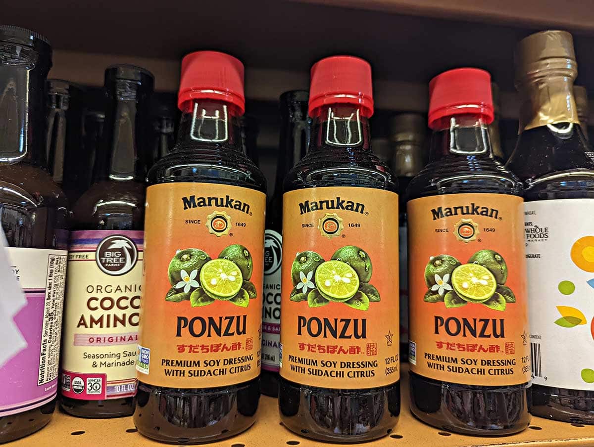Ponzu sauce bottles on the shelf at the grocery store. 