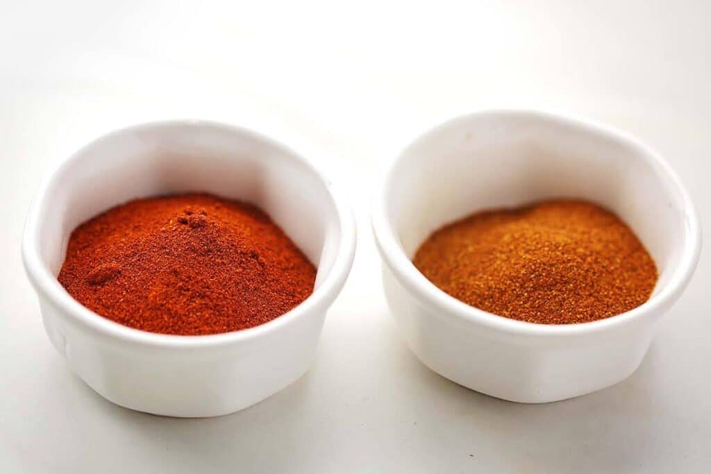 two bowl with different type of paprika spice. 