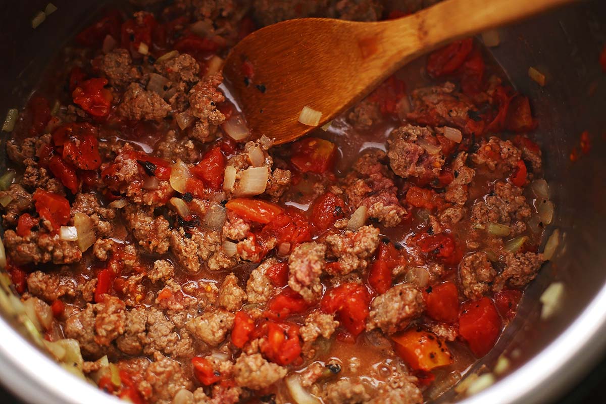 instant pot with ground beef and tomatoes