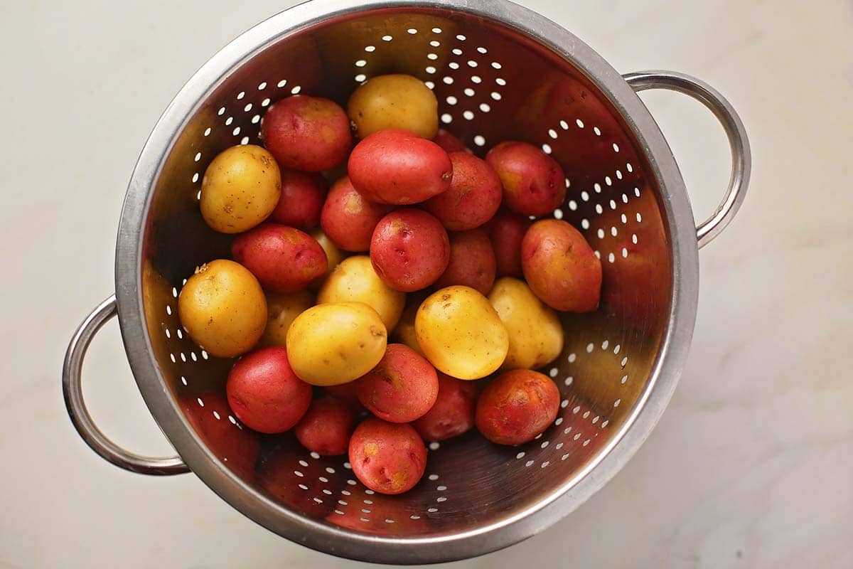 colander with washed baby potatoes