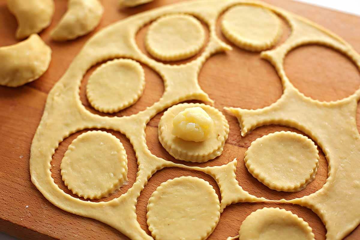 rolled out dough with cut out circles to make dumplings