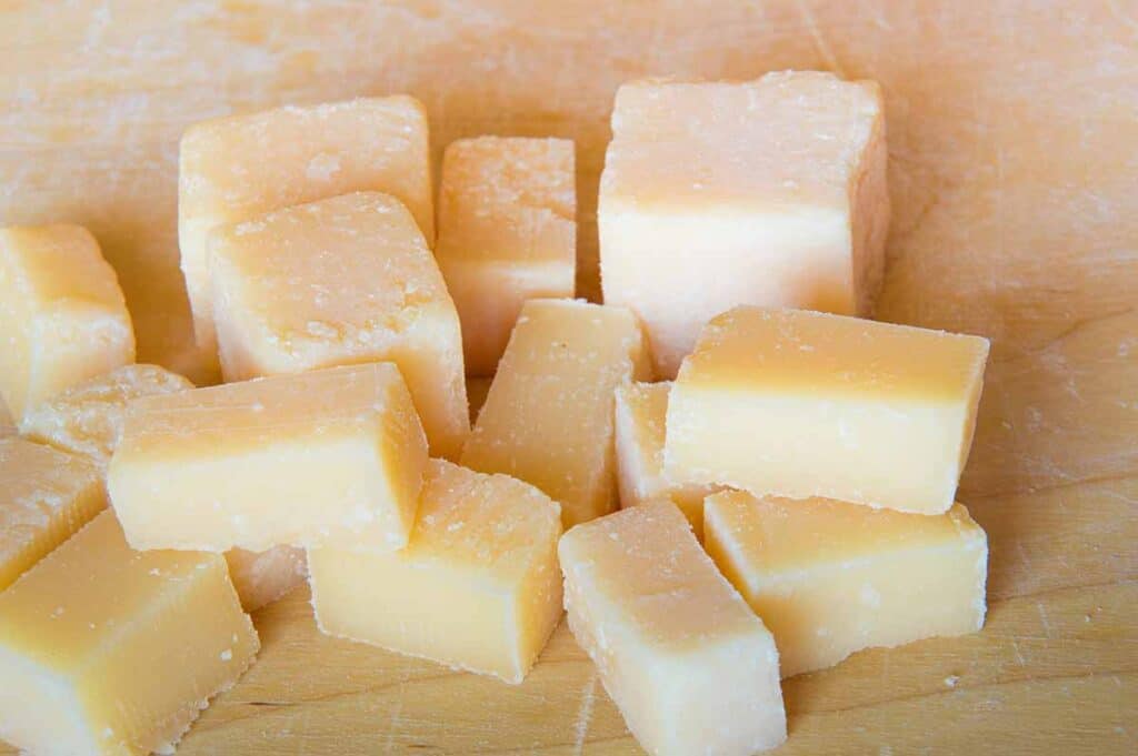 Close up shot of Grana Padano cheese cubes. 
