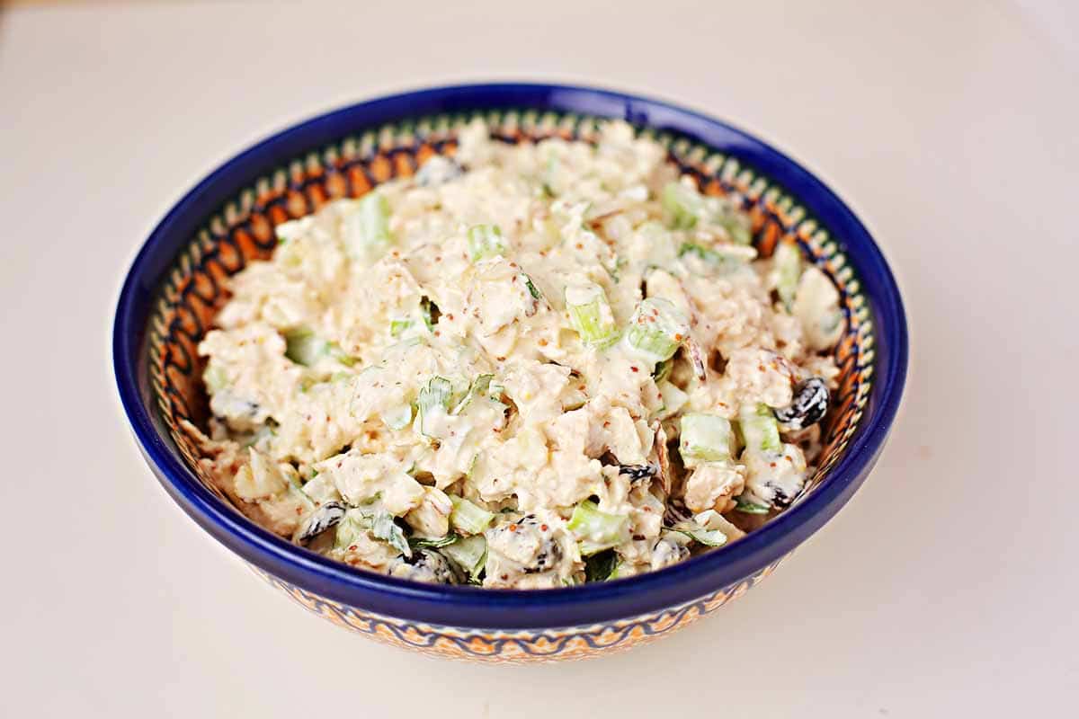 navy-colored bowl with creamy white salad 