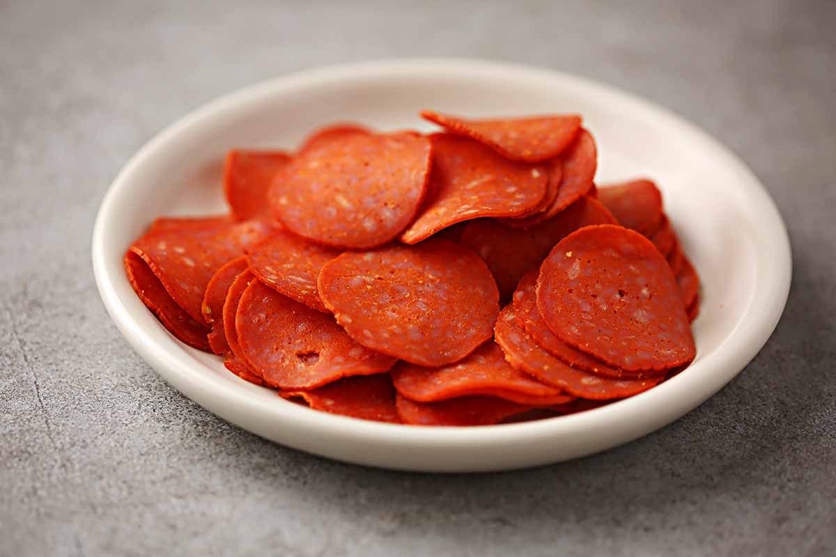 small dish filled with pepperoni slices