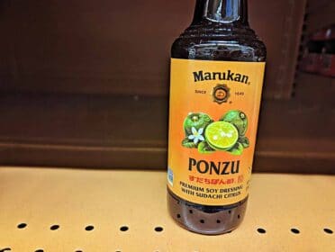 bottle with ponzu sauce on the shelf at the grocery store.