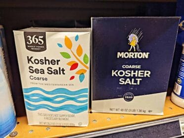 shelf with two packages of kosher salt
