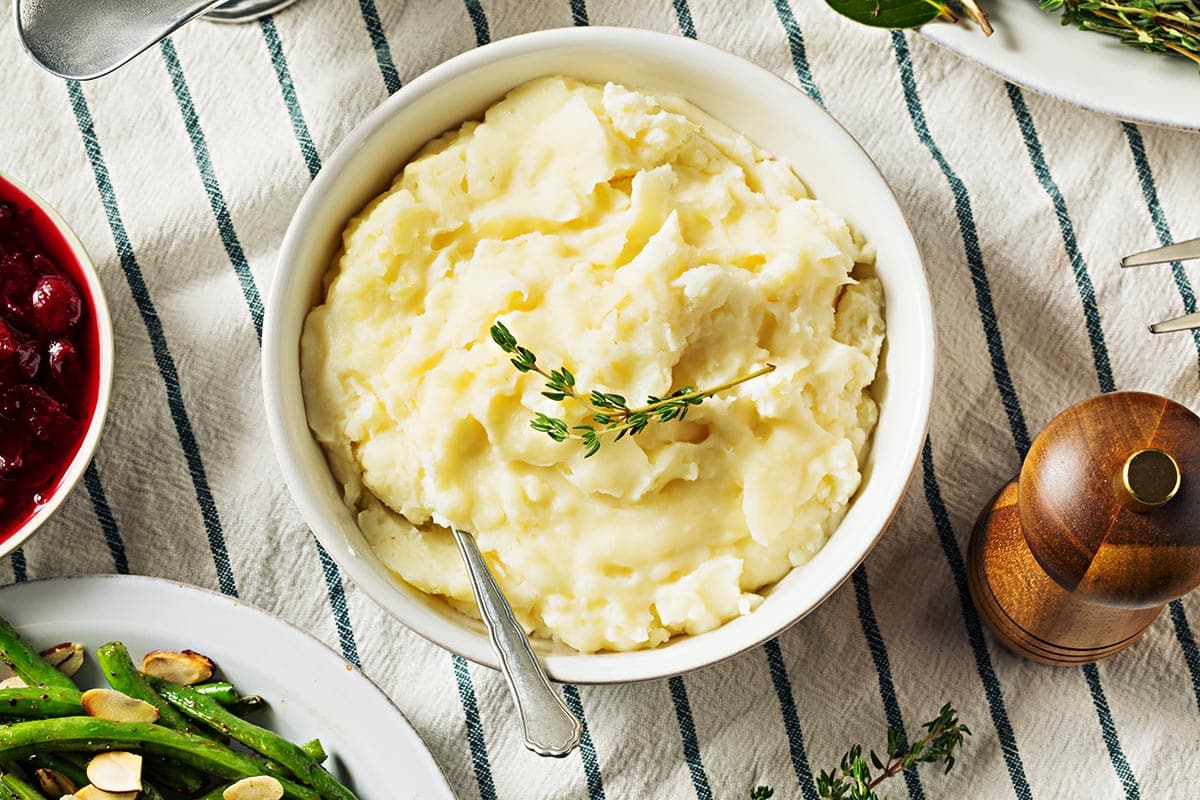 white bowl filled with mashed potatoes.