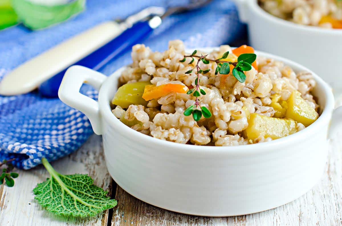 white dish with barley and meat stew.