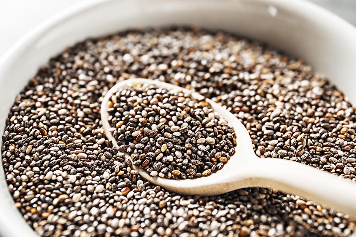 Close up shot of raw chia seeds in the bowl. 
