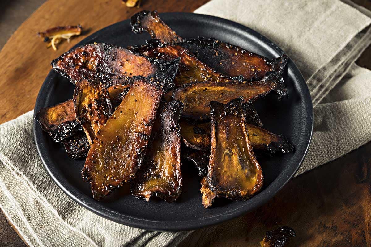 Cast iron with fried vegan mushroom bacon inside. 