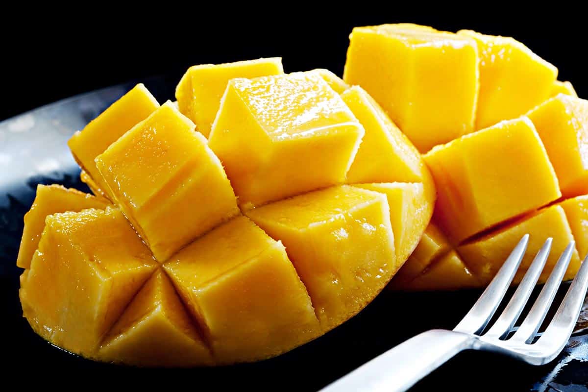 Sliced mango on a plate, close up shot. 