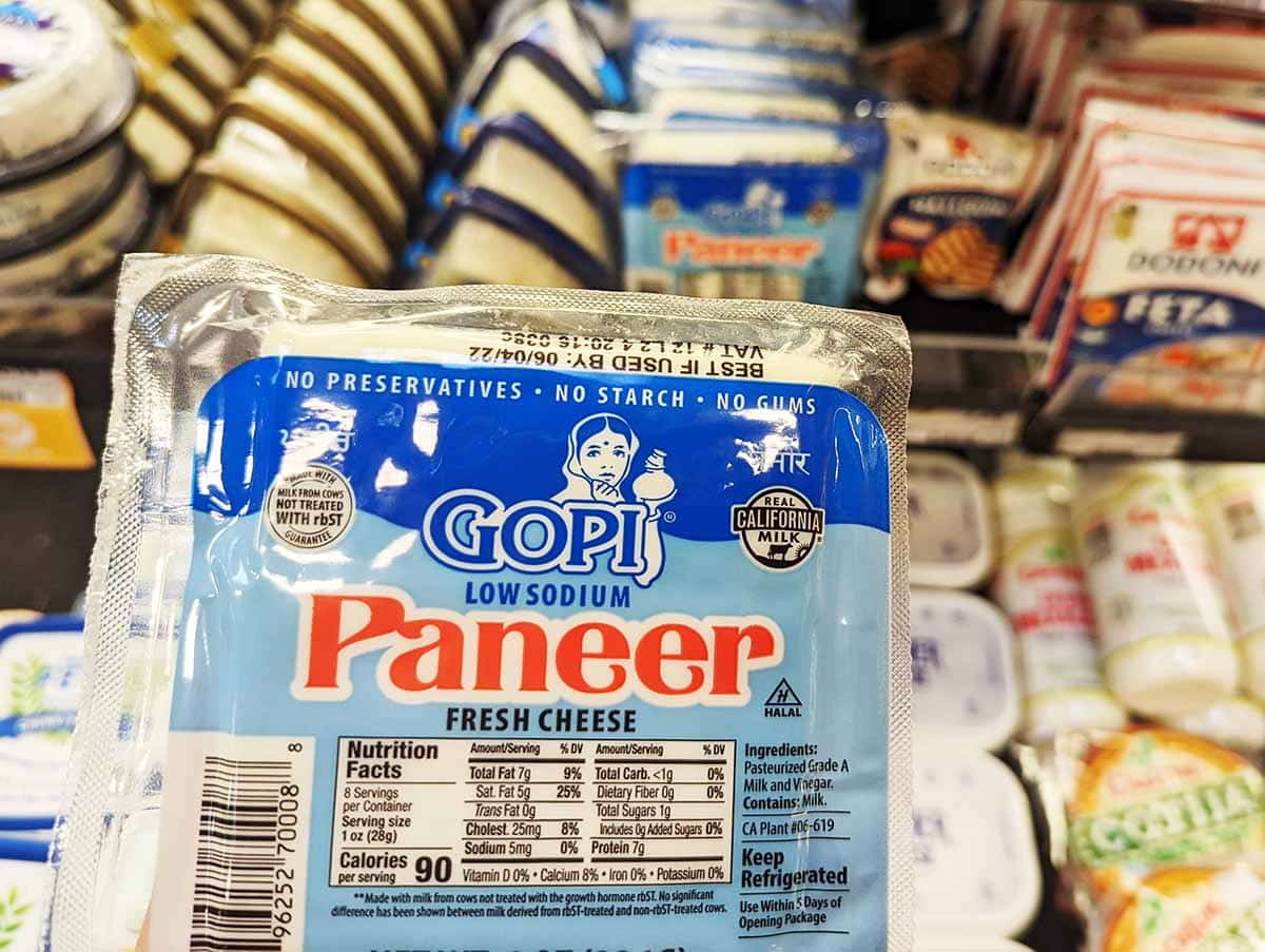 Package of cheese with the name on it Paneer. 