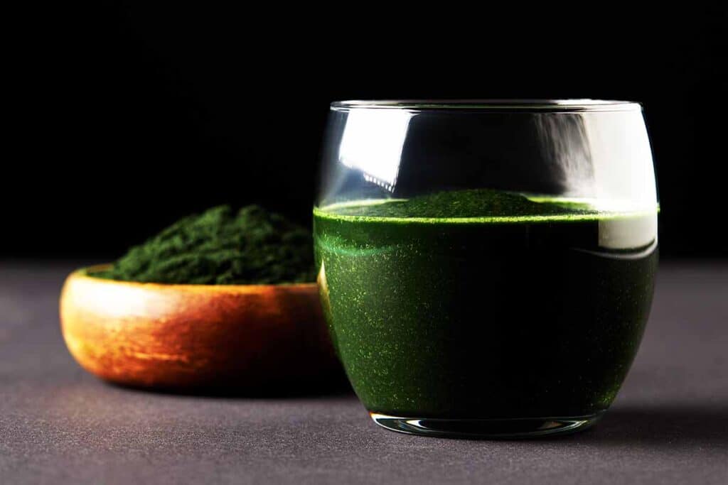 Glass filled with green Spirulina Smoothie. 