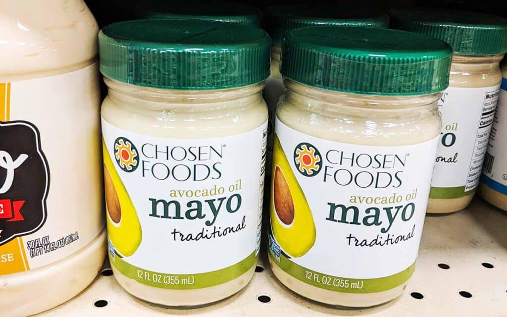 Jar with Mayonnaise on the shelf at the store. 