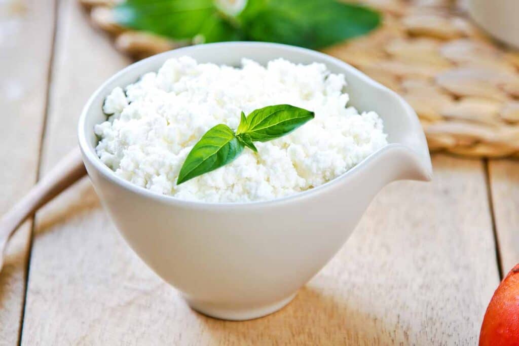 White dish filled with homemade ricotta