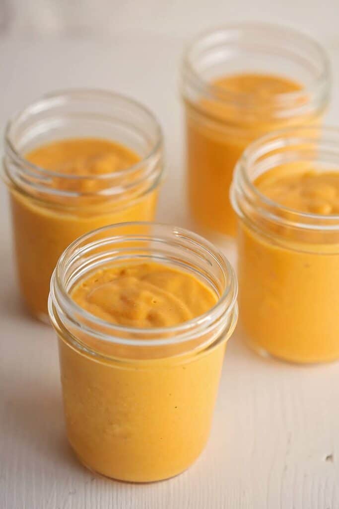 Mason jar with turmeric mango smoothie